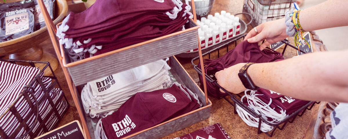 photo of Texas A&M branded masks and hand sanitizers